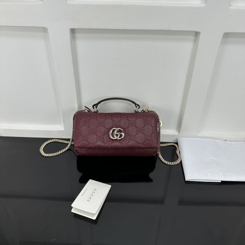 G*u*i top handle bags